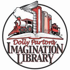 Row of books with train bookends on an open book. Caption reads Dolly Parton's Imagination Library